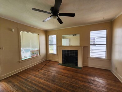 Unfurnished living room with crown molding, a tile