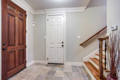 The welcoming entryway features tile flooring. The
