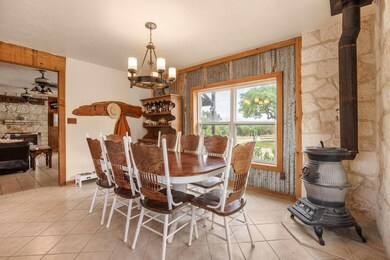 Dining area with light tile patterned flooring, a