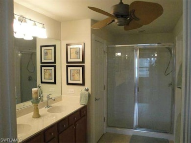 Master bedroom bath with dual sinks, shower and custom ceiling fan.