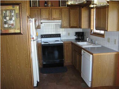 Very nice kitchen area with window above the sink,