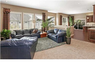 Open floor plan with bank of south windows. See th