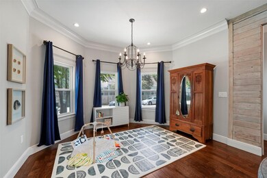 The stunning double pane bay windows, crown moldin