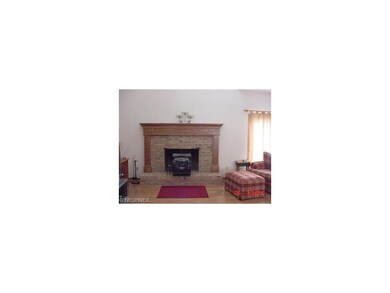 Stately brick fireplace with solid oak mantle in t