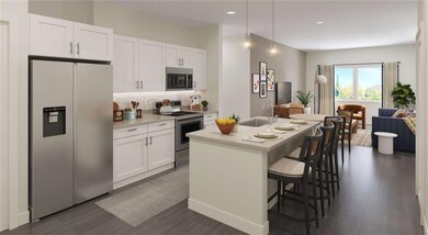 Kitchen with stainless steel appliances, a sink, tasteful backsplash, white cabinetry, and dark wood-style floors