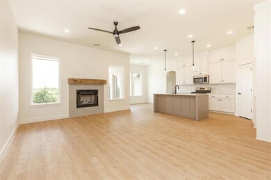 Kitchen featuring decorative light fixtures, light