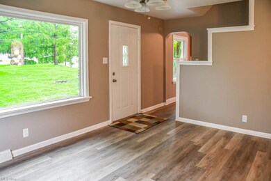 The living room features a huge picture window.