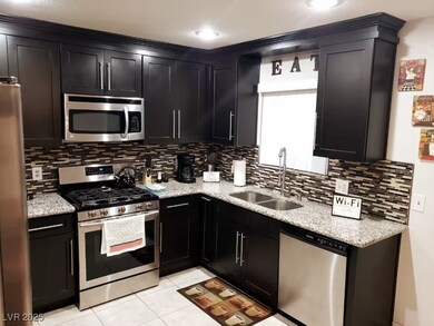 Kitchen with appliances with stainless steel finis