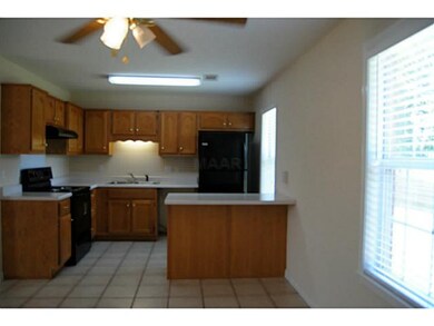 Kitchen - Tile Flooring, Range/Oven, Refrigerator,
