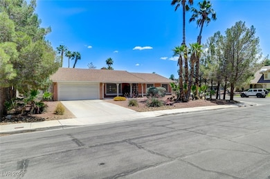 Single story home with a garage, concrete driveway