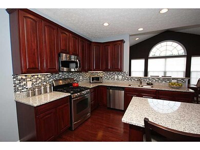 Kitchen. The gourmet kitchen features granite coun