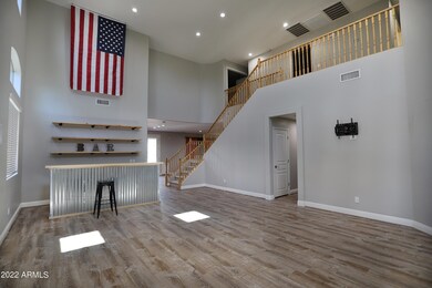 Front room & stairs with wood railing