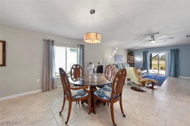 Tiled dining space with abundant sunlight
