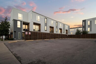 View of front facade with uncovered parking and fe