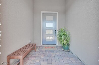 View of exterior entry with stucco siding