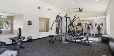 Gym featuring carpet flooring, lofted ceiling, recessed lighting, and a ceiling fan