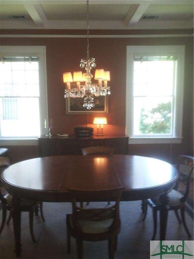 diningroom with chandilier, coffered ceiling, orie