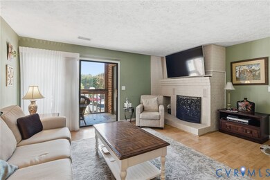 Family rm/Living rm, brick fireplace, custom vertical blinds for sliding doors to screened balcony.