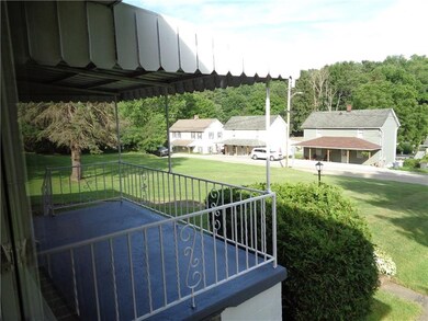 View from living room and large covered front porc