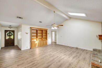 Living room with baseboards, a ceiling fan, visibl