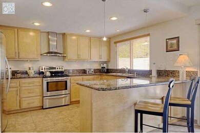 Beautiful open layout. Stainless appliances, custom cabinets and tile floors
