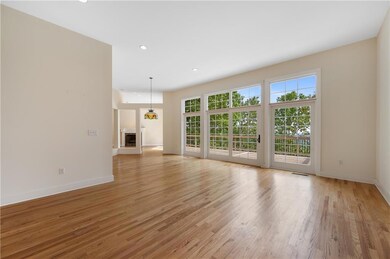 Floor to ceiling windows and Hardwood floors.
