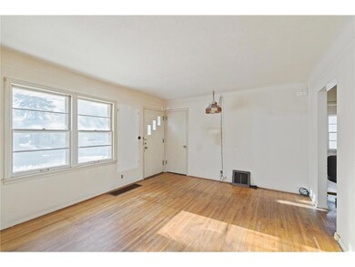 Spacious living room with hardwood floors