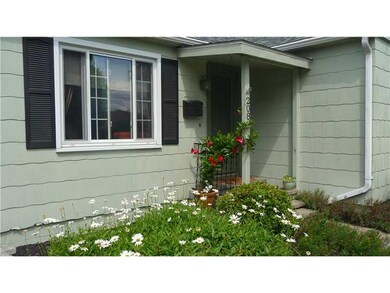 Exterior Front. Landscaped with beautiful flowers.