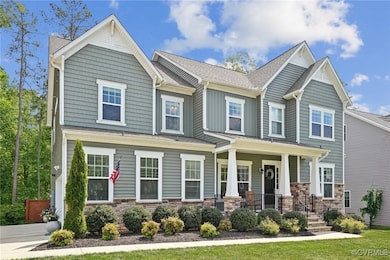 Craftsman-style house featuring covered porch, a s