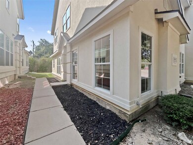 View of side of home with stucco siding