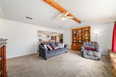 Living room with lofted ceiling with beams, ceilin