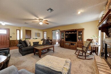 Living room featuring light colored carpet, wainsc