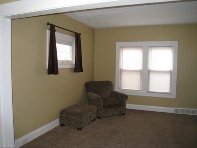 Light, bright living room with neutral dcor.