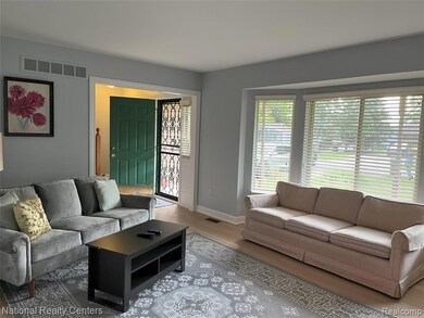 Living area featuring wood finished floors and baseboards