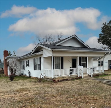 View of front of home with covered porch, a front 