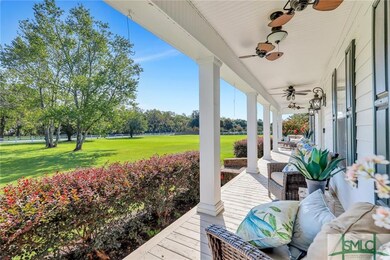 Spacious covered front porch with relaxing views