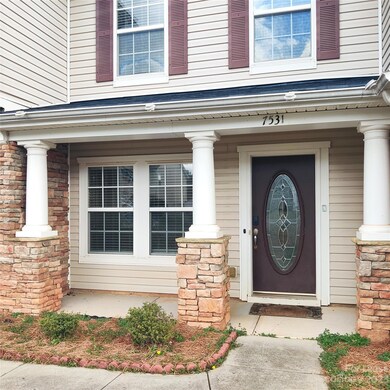 Welcoming covered front sitting porch