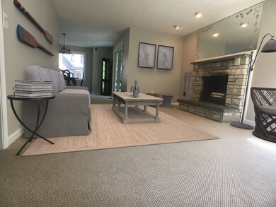 Recessed lights accent the Fireplace which leads t
