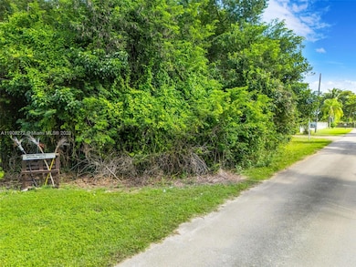 STREET VIEW OF THE 1.13 VACANT LAND LOT IN REDLAND ON A QUIET STREET. SW 197 AVE & SW 234 ST - SIGN ON PROPERTY