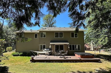 View of entertainment-sized sundeck. Large deck allows separate BBQ/Outdoor dining, lounging and hot-tub areas.