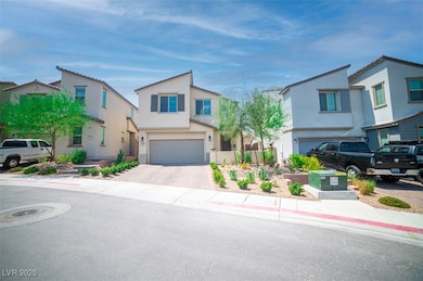 View of front of property with stucco siding, decorative driveway, an attached garage, and a residential view