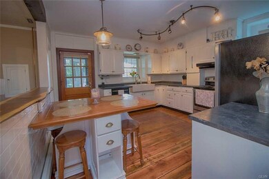 Open concept and updated kitchen with wide plank f