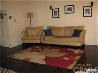 Spacious living area with beautiful wood flooring