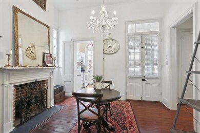 The dining room has high ceilings, a lovely fireplace and gorgeous hardwood floors.