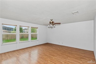 Unfurnished room with light wood-style flooring and a ceiling fan