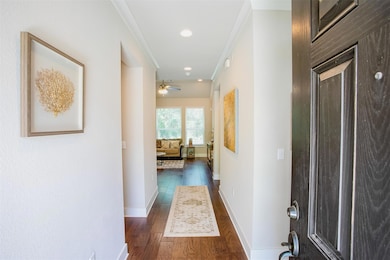 Hall featuring dark wood-type flooring, baseboard