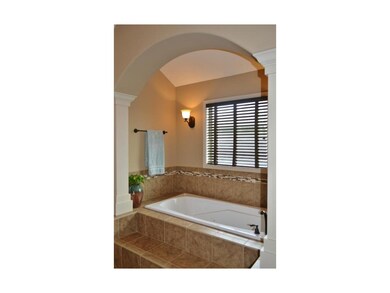 Archway and columns, sconces, greet you for a rela