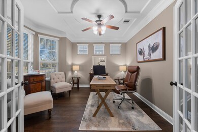 This inviting home office features elegant French