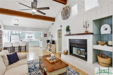 great room with fireplace and vaulted ceiling