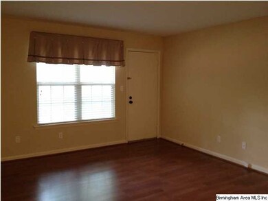 Large great room with access to the covered patio.